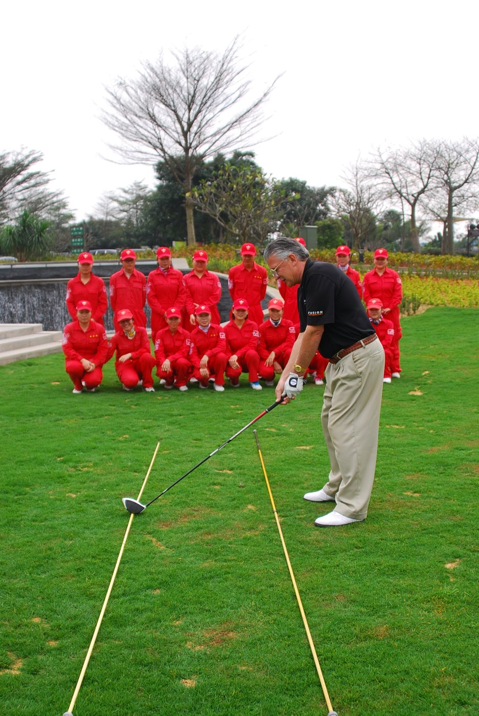 Brett Brasier running a golf clinic in China with alignment sticks
