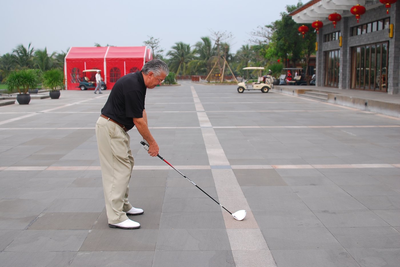 Brett Brasier practising alignment on a clubhouse forecourt in China
