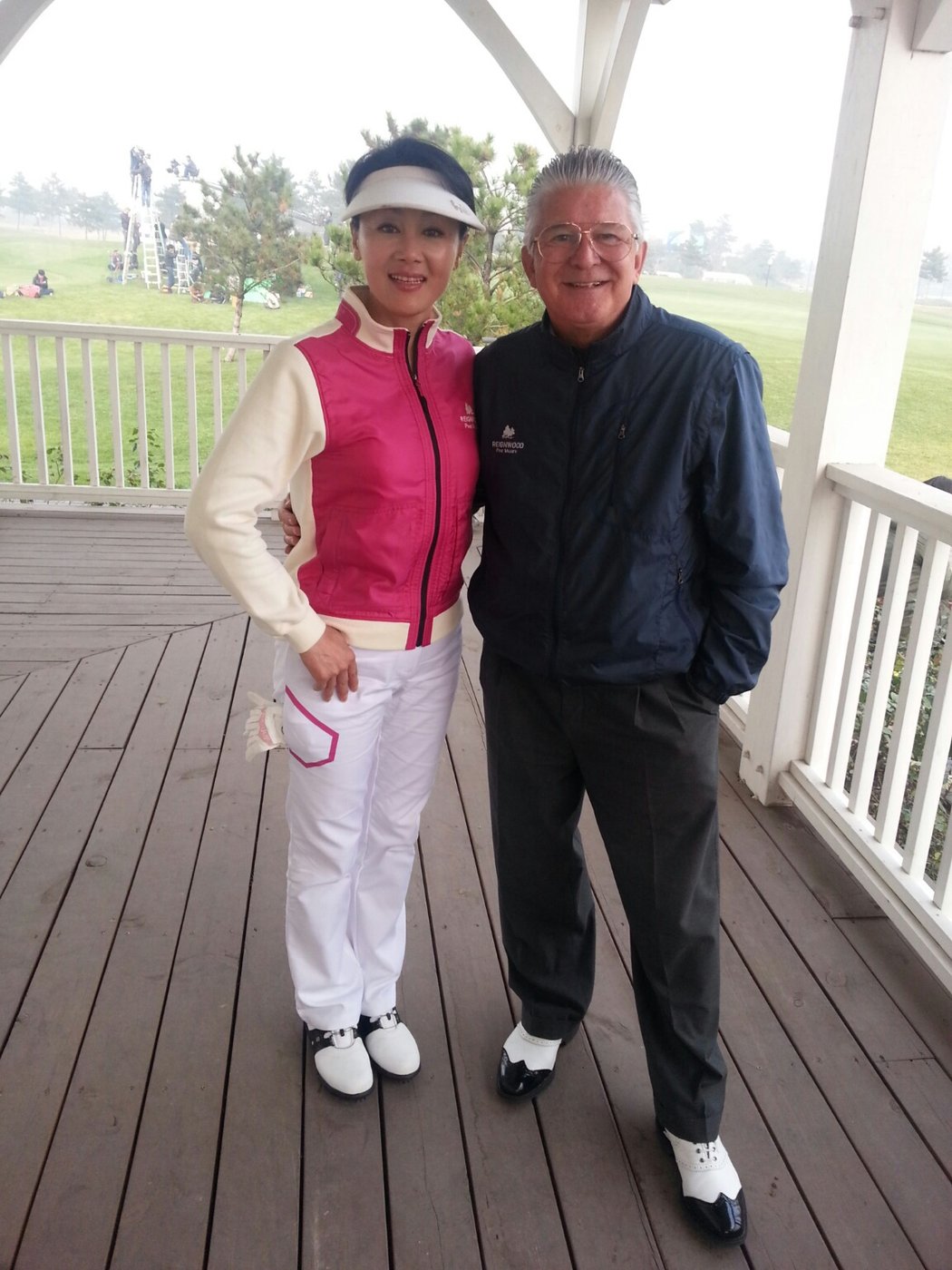 Brett Brasier with a Reignwood Pine Valley member on the clubhouse porch, Beijing