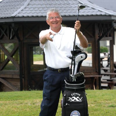 Brett Brasier portrait with golf bag