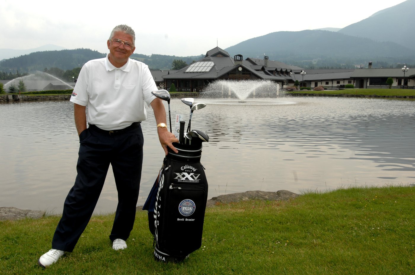 Brett Brasier with his tour bag beside a lake at Prosper Golf Resort Čeladná, Czech Republic