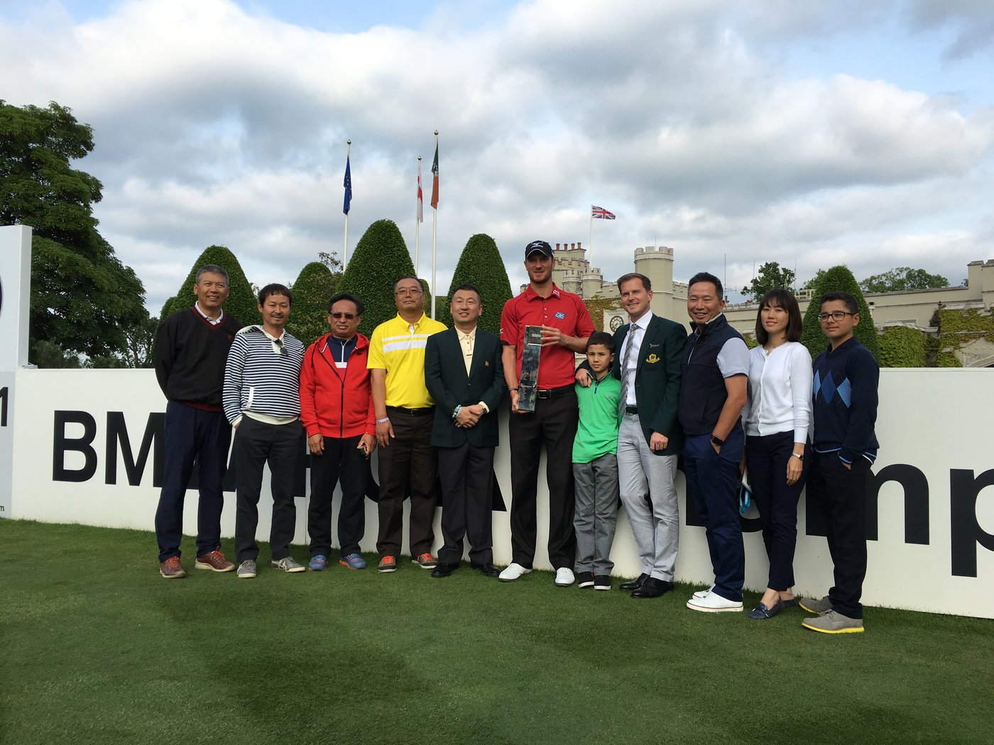Chris Wood, winner of the 2016 BMW PGA Championship, with Michael Brasier and Reignwood Pine Valley Golf Club members at Wentworth Club