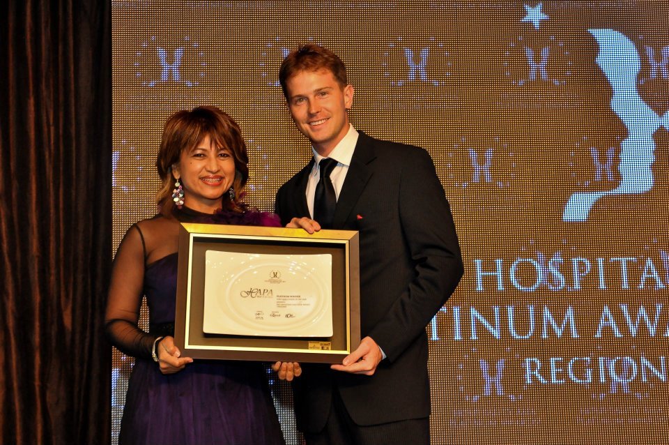 Michael Brasier accepting a Hospitality Asia Platinum Award