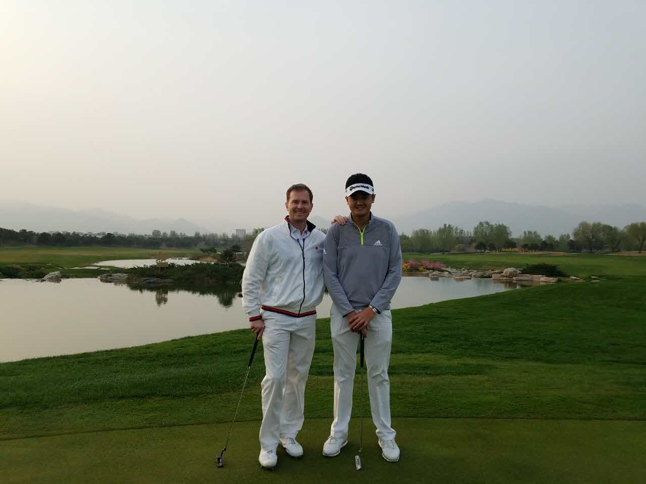 Michael Brasier playing a round with Chinese professional golfer William Liu on the Nicklaus Course at Reignwood Pine Valley, Beijing